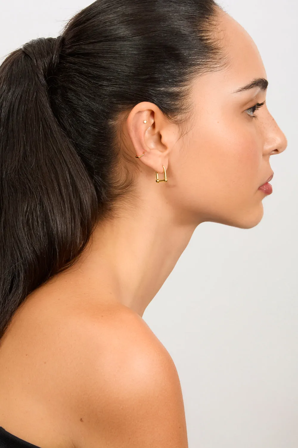 Gold D-shaped hoop earrings