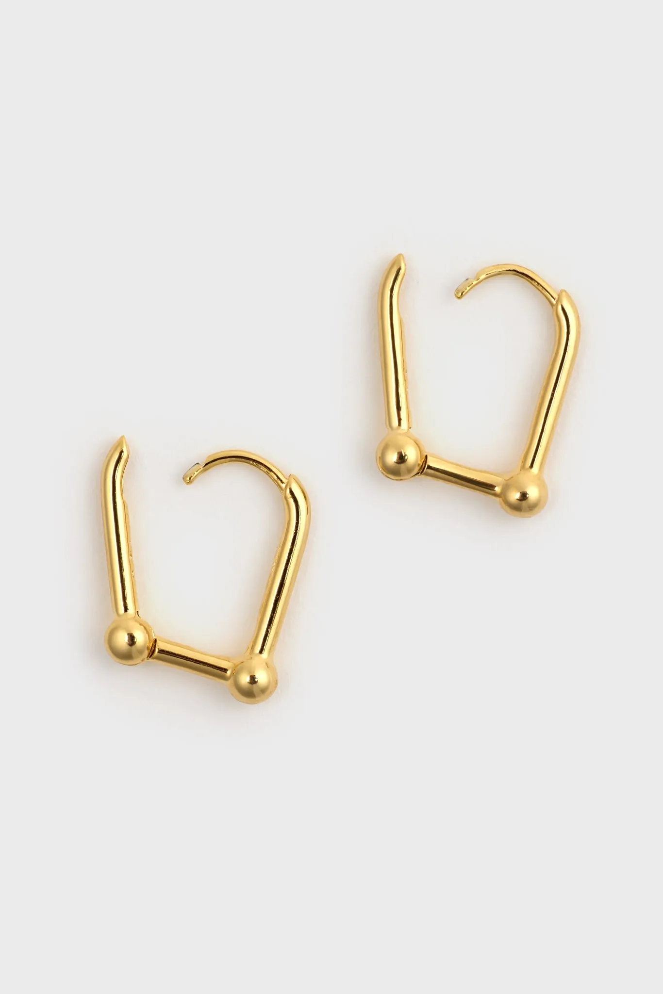 Gold D-shaped hoop earrings