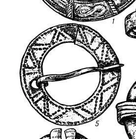Round Medieval brooch with incised decoration