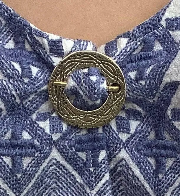 Round Medieval brooch with incised decoration