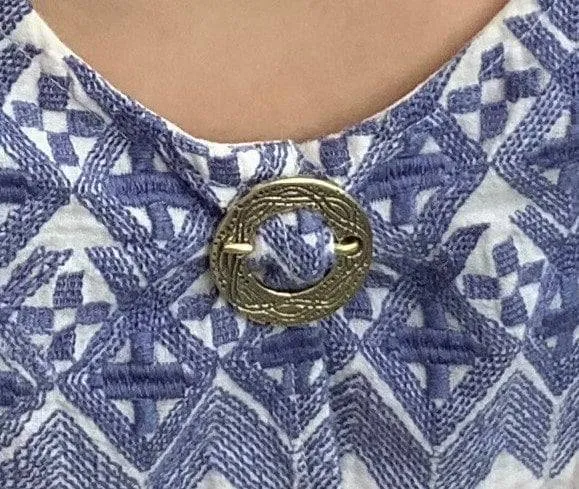 Round Medieval brooch with incised decoration